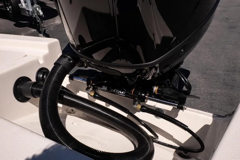 Slide: The Image of 2026 Carolina Skiff 22 Ultra Elite boat engine detail with hydraulic steering system. - 8