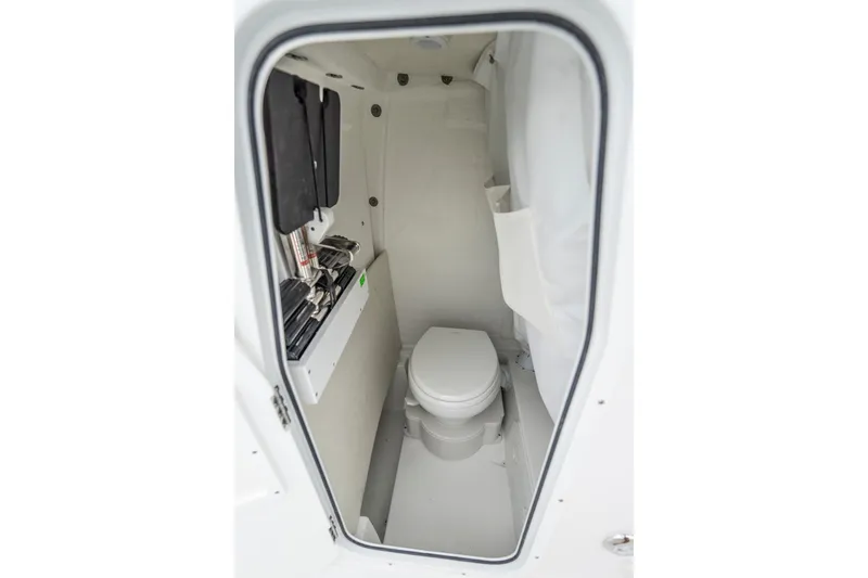 Slide: The Image of 2026 Sea Hunt Ultra 245 SE boat interior at a showroom display. - 13