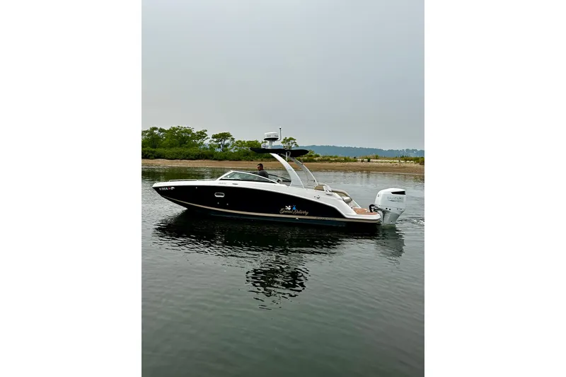 Slide: The Image of 2016 Four Winns Ho270 boat on calm water with scenic background. - 32