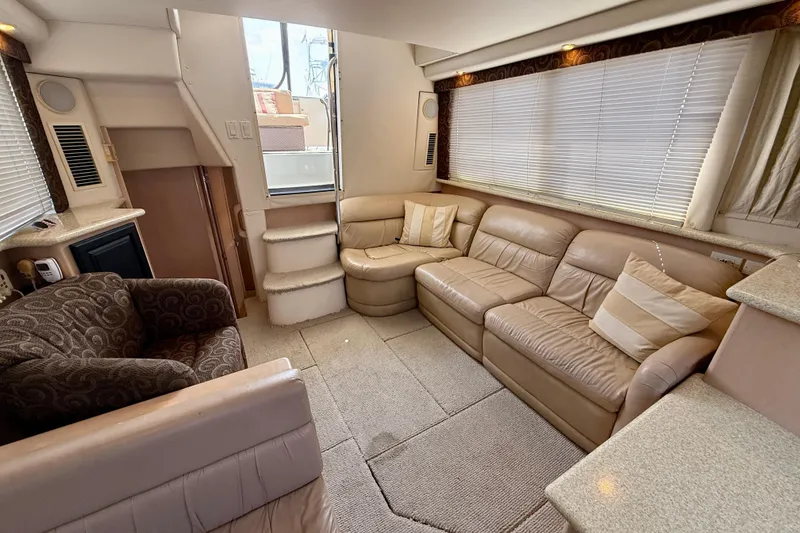 Slide: The Image of Interior of 2000 Carver 356 Aft Cabin Motor Yacht with beige leather seating. - 16