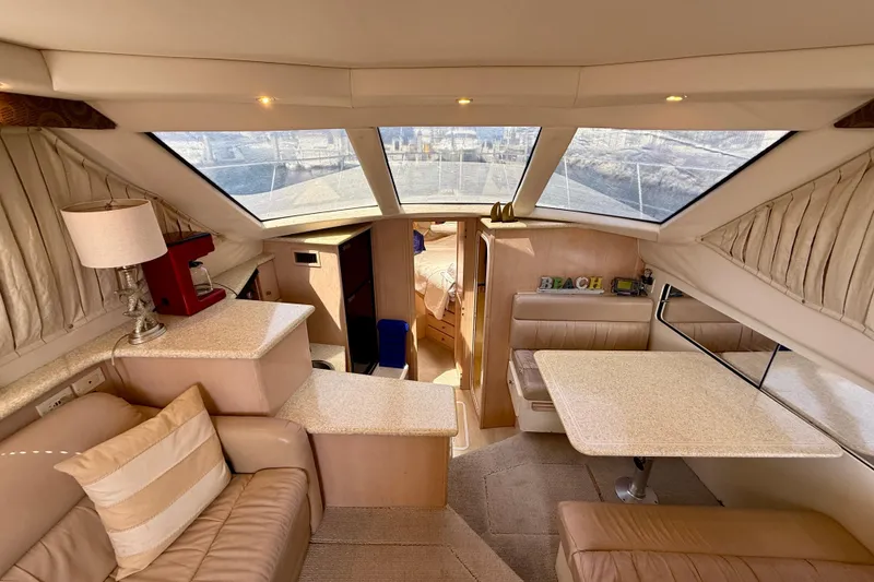 Slide: The Image of Luxurious interior of 2000 Carver 356 Aft Cabin Motor Yacht with seating and table. - 17