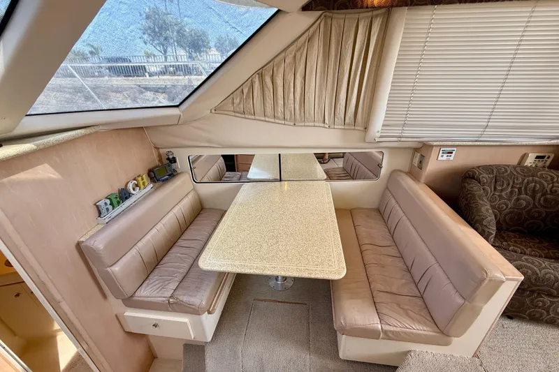 Slide: The Image of Interior of 2000 Carver 356 Aft Cabin Motor Yacht with dining area and seating. - 18