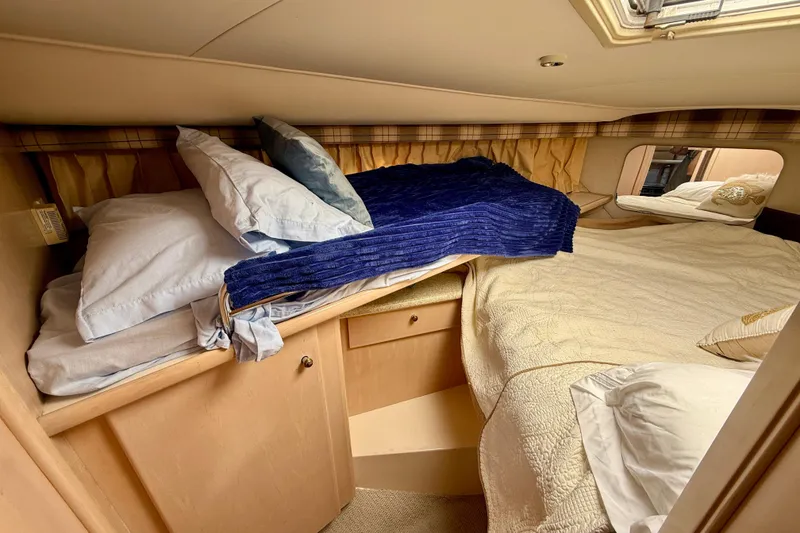 Slide: The Image of Cozy cabin interior of 2000 Carver 356 Aft Cabin Motor Yacht with bedding. - 23