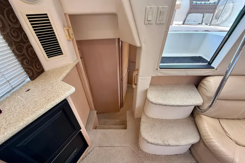 Slide: The Image of Interior of 2000 Carver 356 Aft Cabin Motor Yacht with stairs and seating area. - 25