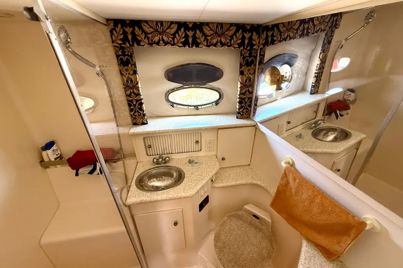 Slide: The Image of Bathroom interior of 2000 Carver 356 Aft Cabin Motor Yacht, featuring sink and shower. - 28