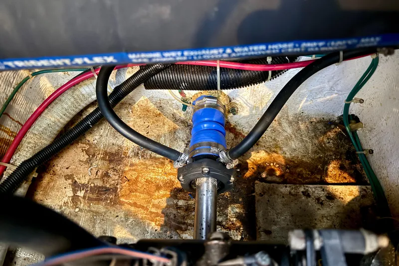 Slide: The Image of Engine compartment of 2000 Carver 356 Aft Cabin Motor Yacht with visible hoses and fittings. - 34
