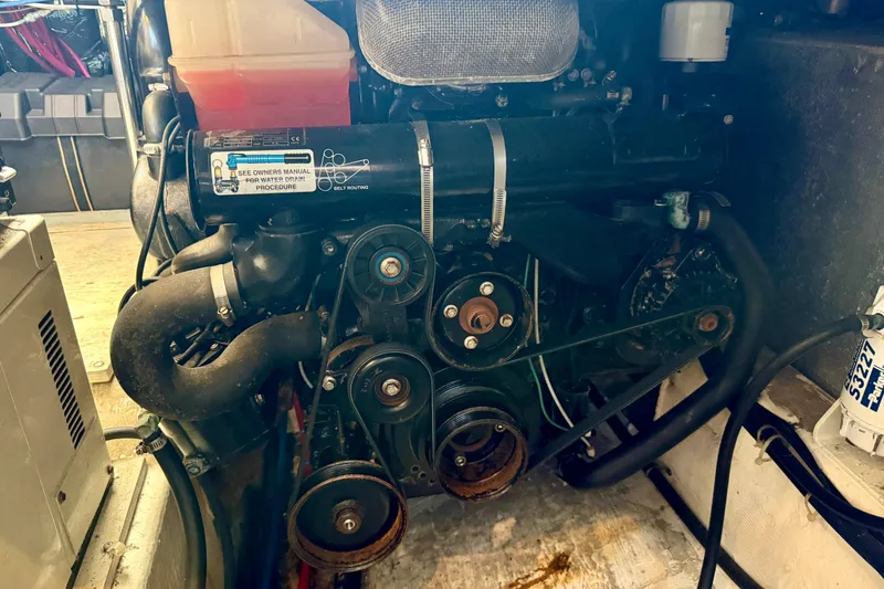 Slide: The Image of Engine compartment of a 2000 Carver 356 Aft Cabin Motor Yacht, showing belts and components. - 35