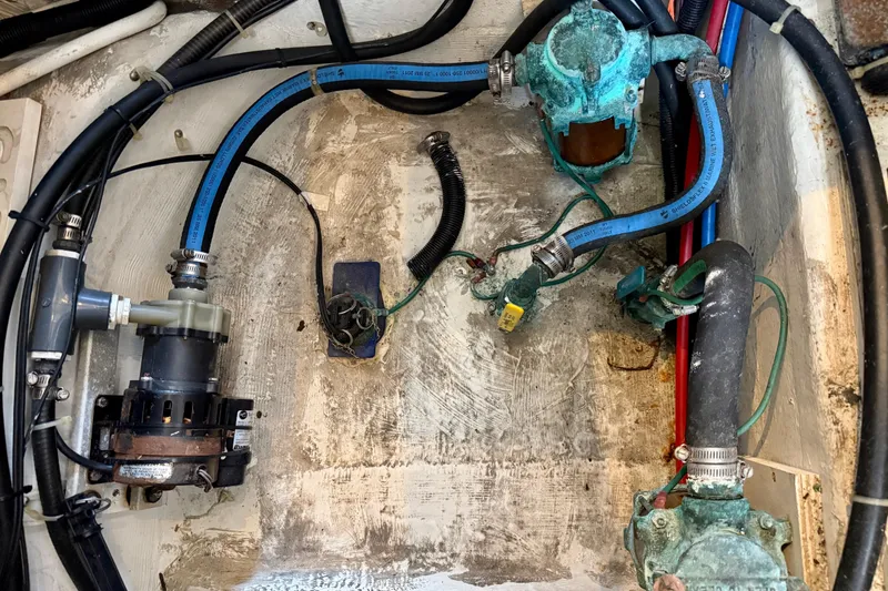 Slide: The Image of Engine room of 2000 Carver 356 Aft Cabin Motor Yacht with visible plumbing and wiring. - 36