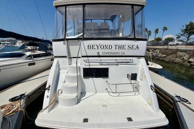 Slide: The Image of 2000 Carver 356 Aft Cabin Motor Yacht docked, named "Beyond the Sea," Coronado, CA. - 4