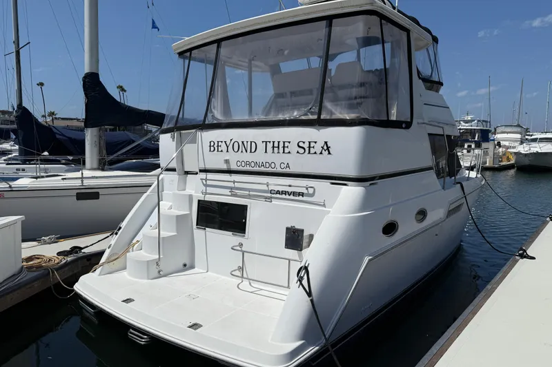 Slide: The Image of Carver 356 Aft Cabin Motor Yacht 2000 docked, named "Beyond the Sea," Coronado, CA. - 5