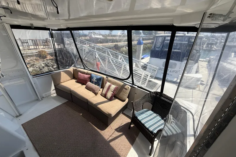 Slide: The Image of Interior of 2000 Carver 356 Aft Cabin Motor Yacht with cozy seating area. - 8
