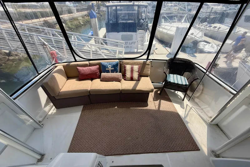 Slide: The Image of Interior of 2000 Carver 356 Aft Cabin Motor Yacht with cozy seating area. - 9