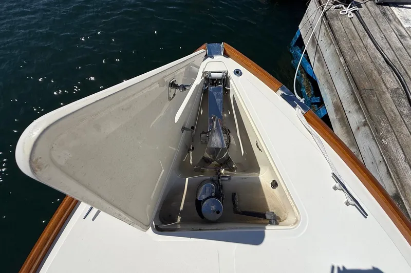 Slide: The Image of Bow anchor compartment of a 2001 Hinckley Classic Picnic Boat at dock. - 10