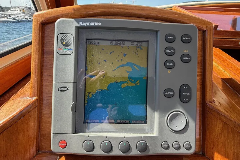 Slide: The Image of Raymarine navigation system on 2001 Hinckley Classic Picnic Boat dashboard. - 32