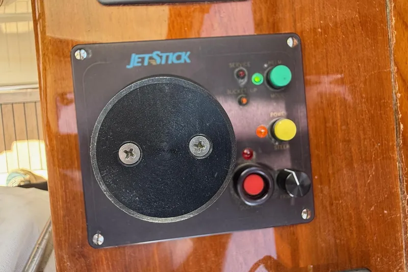 Slide: The Image of Control panel of a 2001 Hinckley Classic Picnic Boat with JetStick system. - 38