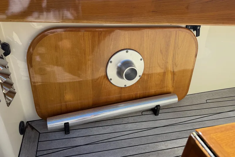 Slide: The Image of 2001 Hinckley Classic Picnic Boat interior with wooden panel and metal fixture. - 21
