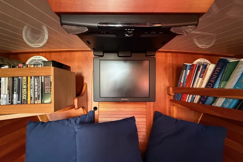 Slide: The Image of Interior of 2001 Hinckley Classic Picnic Boat with TV, books, and DVDs. - 55