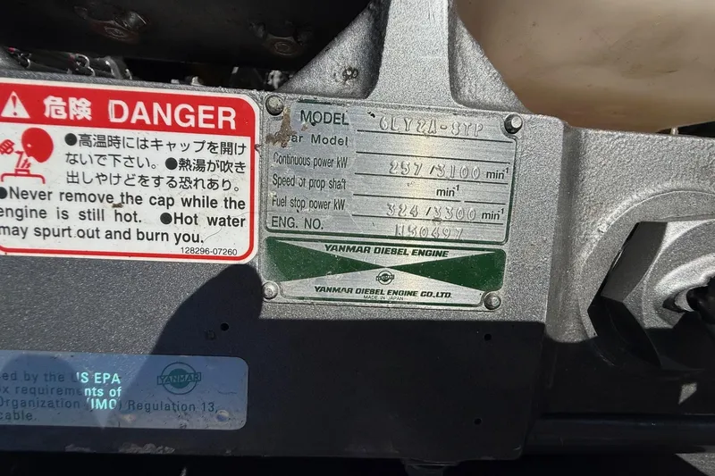 Slide: The Image of Yanmar diesel engine warning labels on a 2001 Hinckley Classic Picnic Boat. - 73