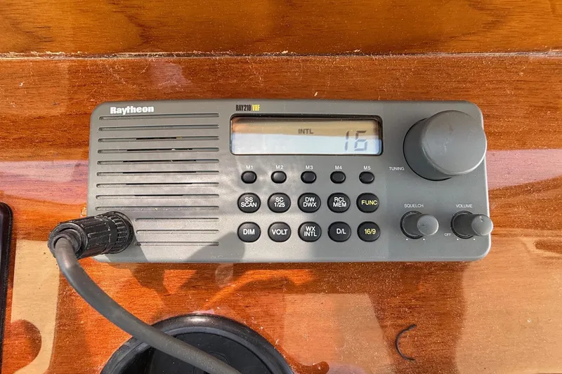 Slide: The Image of Raytheon RAY210 VHF radio on 2001 Hinckley Classic Picnic Boat dashboard. - 36