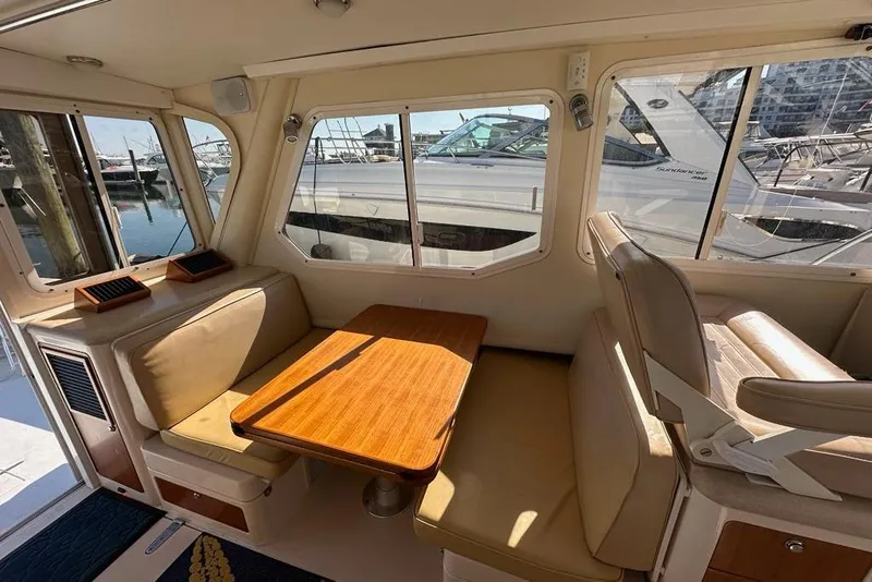 Slide: The Image of Interior of 2002 True North 38 Heritage boat with seating and table. - 14