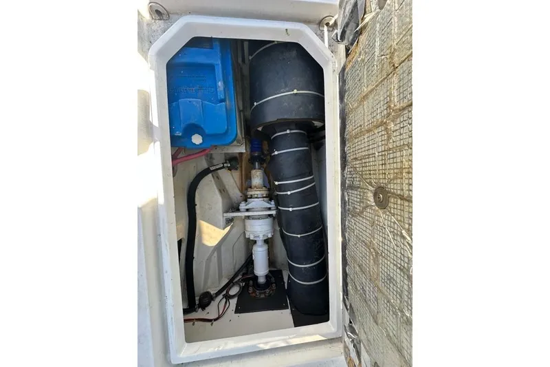 Slide: The Image of Engine compartment of a 2002 True North 38 Heritage boat, showing mechanical components. - 34