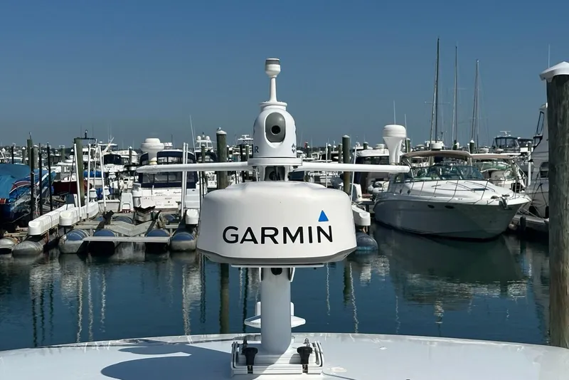 Slide: The Image of Garmin radar on 2002 True North 38 Heritage boat in marina, surrounded by yachts. - 37