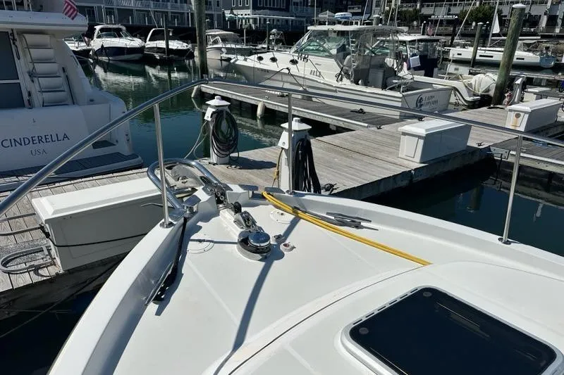 Slide: The Image of Bow of 2002 True North 38 Heritage yacht docked at marina. - 42