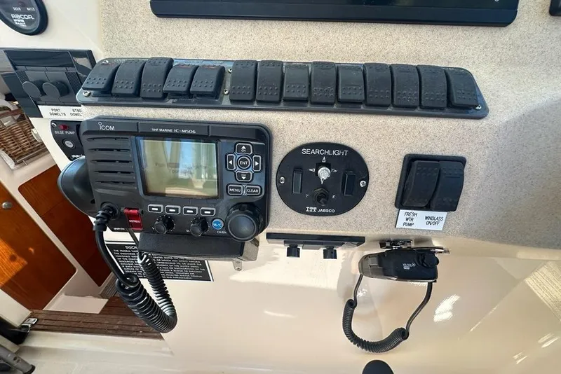 Slide: The Image of Control panel of a 2002 True North 38 Heritage boat with VHF marine radio. - 9