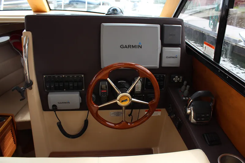 Slide: The Image of Interior helm of 2013 Cutwater 28 LE boat with Garmin navigation system. - 24