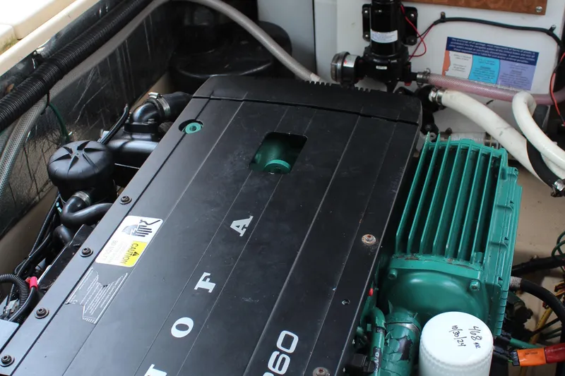 Slide: The Image of Engine compartment of a 2013 Cutwater 28 LE boat, showcasing detailed mechanical components. - 37