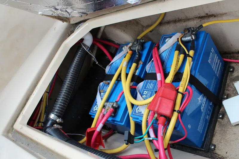 Slide: The Image of Battery compartment of a 2013 Cutwater 28 LE boat with wiring and connections. - 40