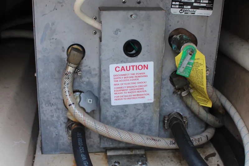 Slide: The Image of Electrical panel with caution label in a 2013 Cutwater 28 LE boat. - 41