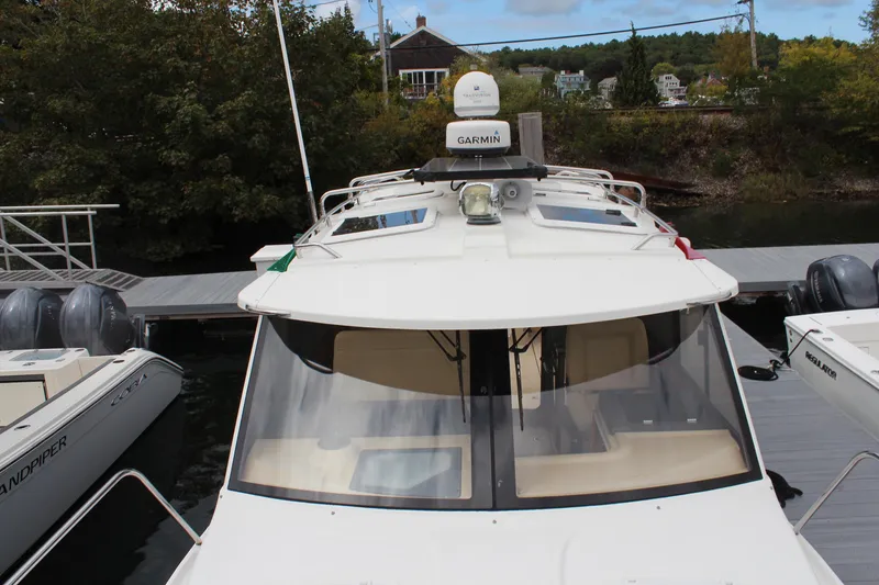 Slide: The Image of 2013 Cutwater 28 LE boat docked with Garmin equipment visible. - 7