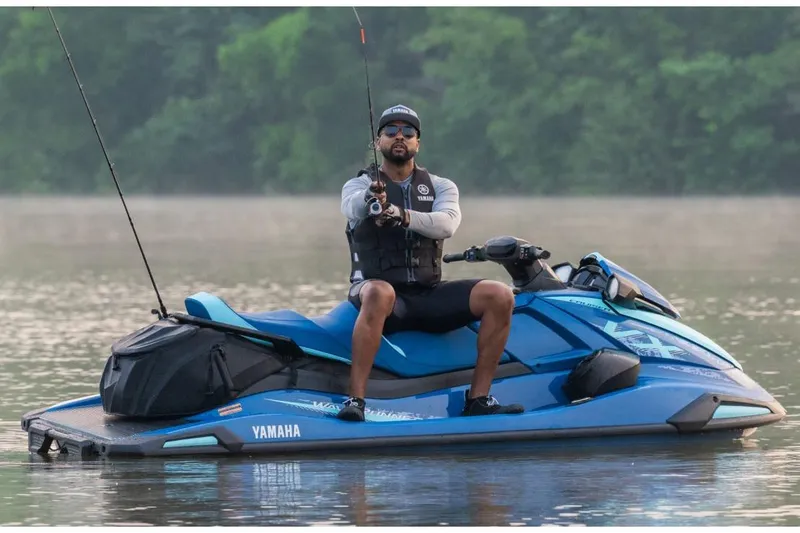 Slide: The Image of 2026 Yamaha WaveRunner VX Cruiser on a calm lake, man fishing. - 5