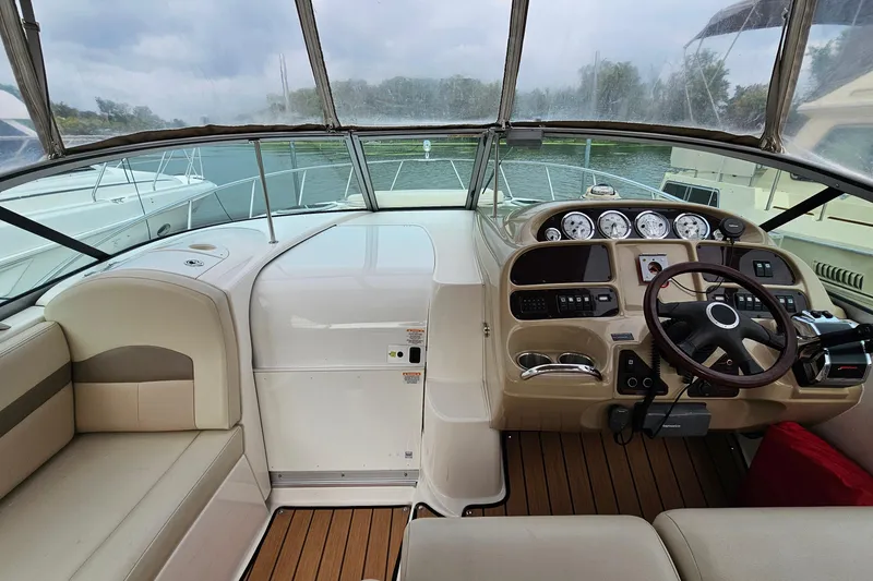 Slide: The Image of 2004 Chaparral Signature 310 boat cockpit with steering wheel and instrument panel. - 15