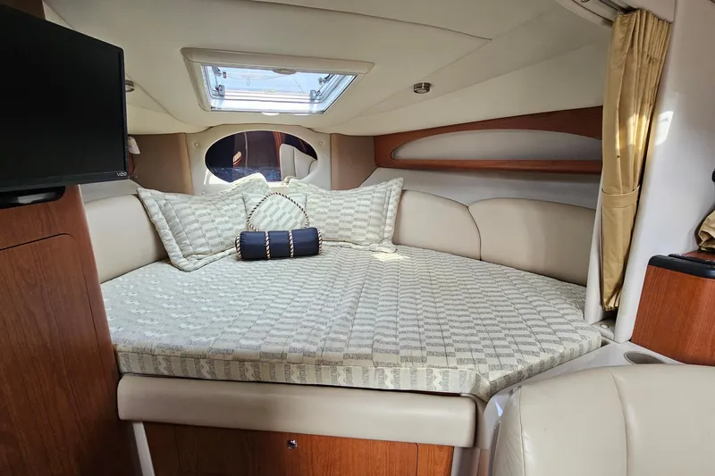 Slide: The Image of Interior of 2004 Chaparral Signature 310 boat with cozy bed and skylight. - 19