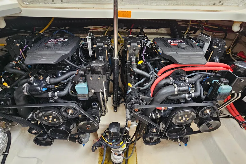 Slide: The Image of Twin engines in a 2004 Chaparral Signature 310 boat, showcasing detailed mechanics. - 25