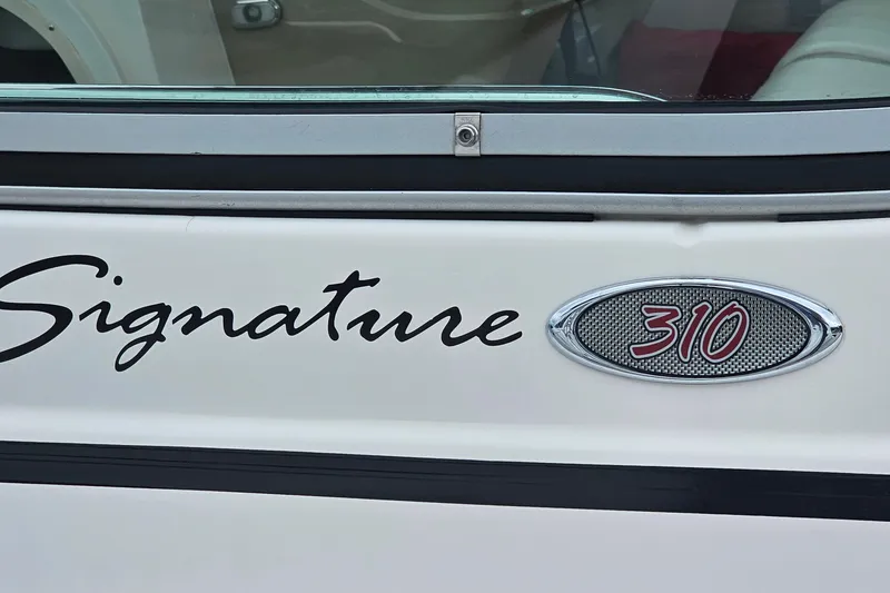 Slide: The Image of 2004 Chaparral Signature 310 boat emblem and logo detail. - 27
