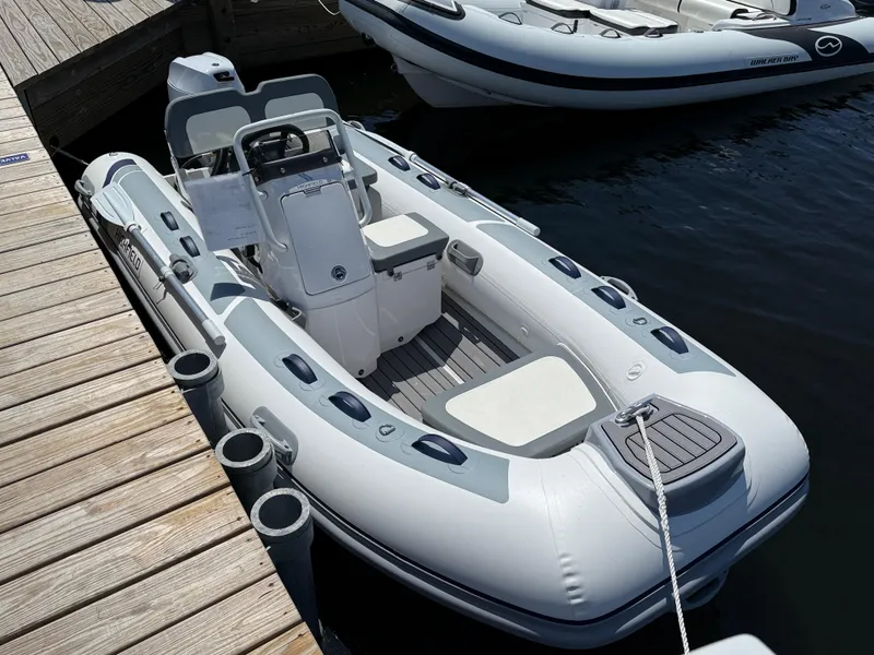 The Image of 2024 Highfield Classic 380 Grand Tour inflatable boat docked at marina. - 0