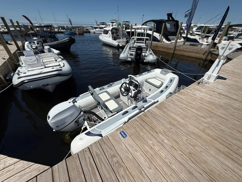 Slide: The Image of 2024 Highfield Classic 380 Grand Tour boat docked at a marina. - 1