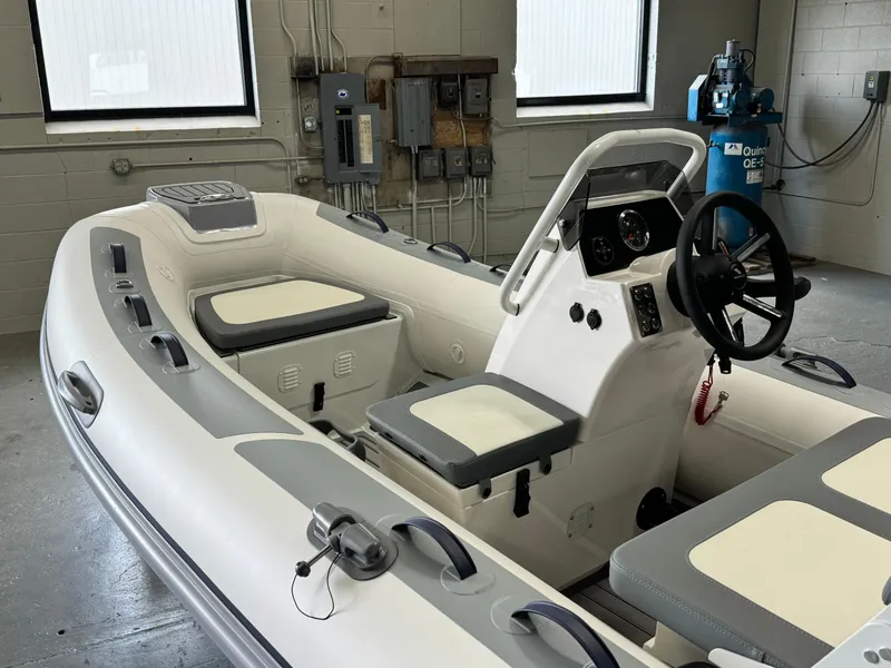 Slide: The Image of 2024 Highfield Classic 380 Grand Tour inflatable boat interior with steering console. - 10
