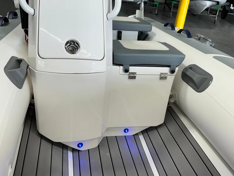 Slide: The Image of 2024 Highfield Classic 380 Grand Tour boat interior with seating and storage. - 16