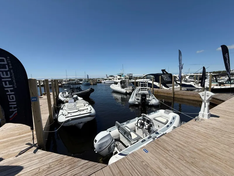 Slide: The Image of Highfield Classic 380 Grand Tour 2024 boats docked at a marina under clear blue skies. - 2