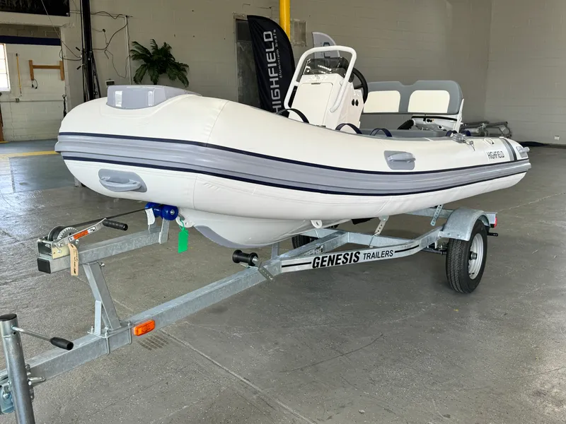 Slide: The Image of 2024 Highfield Classic 380 Grand Tour boat on Genesis trailer in a garage. - 4