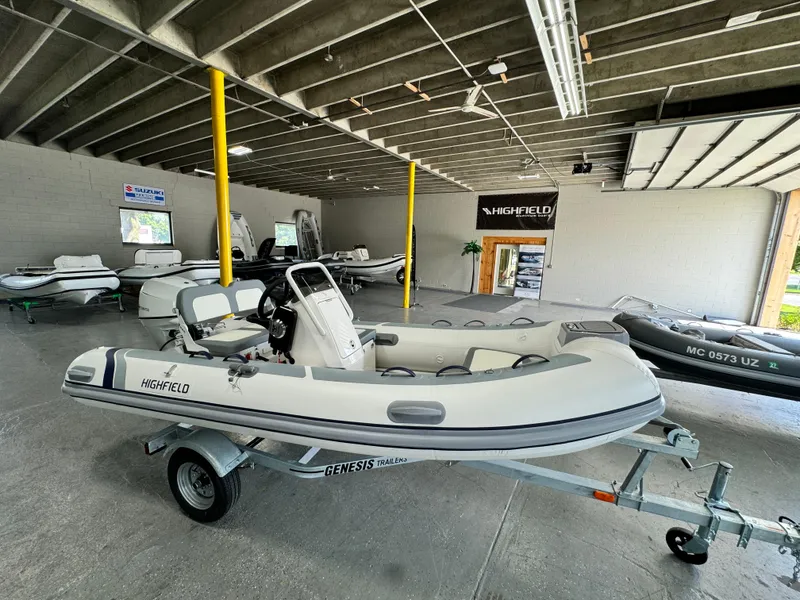 Slide: The Image of 2024 Highfield Classic 380 Grand Tour inflatable boat in showroom on trailer. - 5