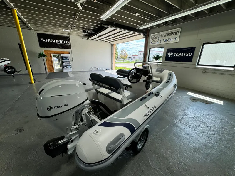 Slide: The Image of 2024 Highfield Classic 380 Grand Tour boat with Tohatsu engine in showroom. - 6