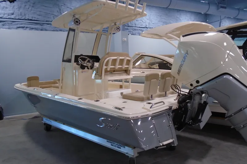 Slide: The Image of 2026 Scout 231 XSB boat with Mercury engine in showroom. - 12