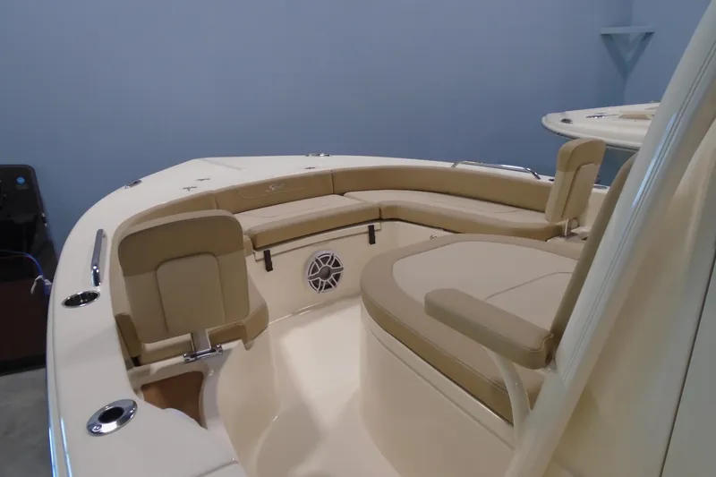 Slide: The Image of 2026 Scout 231 XSB boat interior with beige seating and modern design. - 16