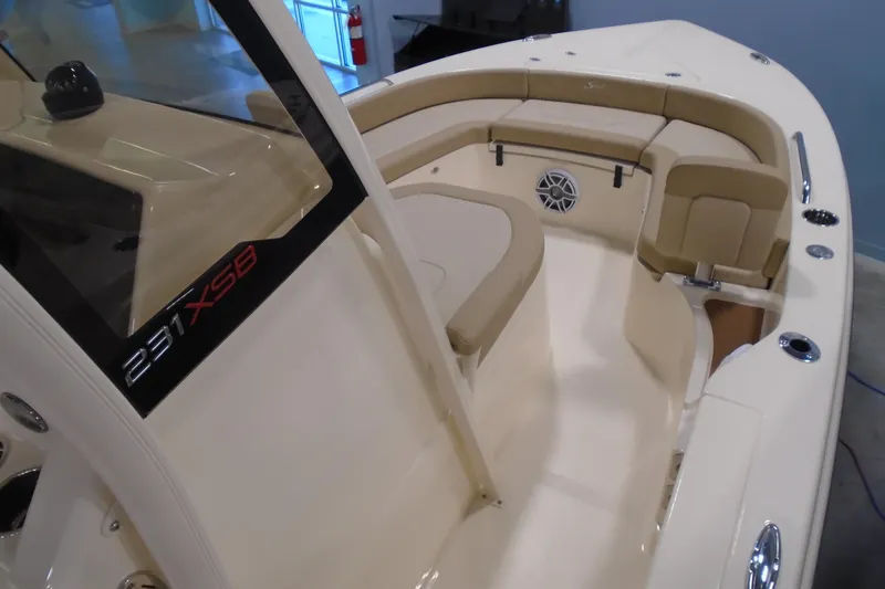 Slide: The Image of 2026 Scout 231 XSB boat interior with beige seating and modern design. - 21