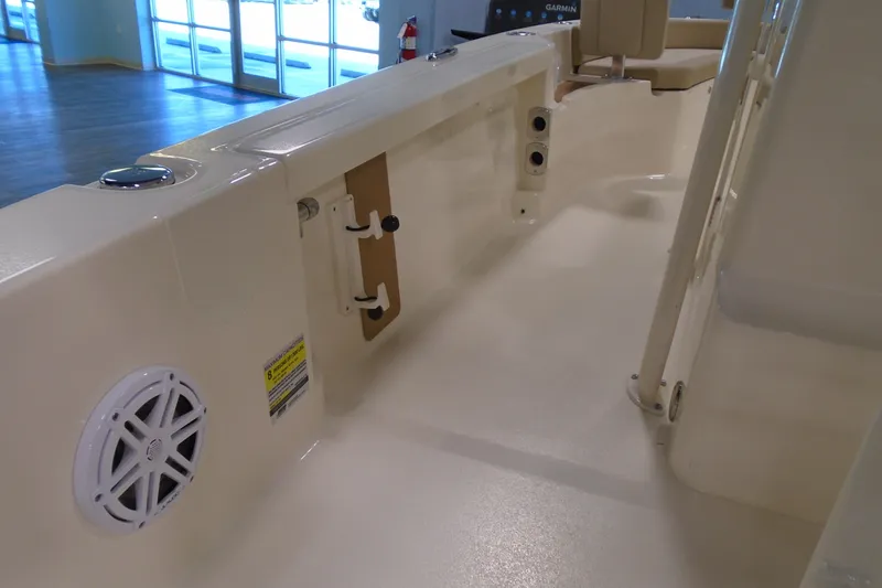 Slide: The Image of 2026 Scout 231 XSB boat interior with speaker and seating area. - 22